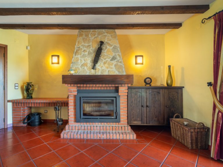 The fireplace gives heat and a warm atmosphere.